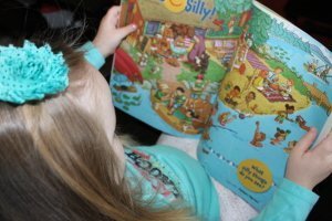 Alivia reading Highlights High Five