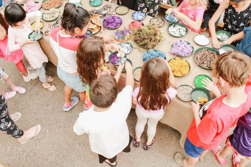 Gardenworks overhead kids filling plant trays