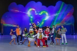 Mickey Disney On Ice Cast standing in front of Mickey Mouse light up stage