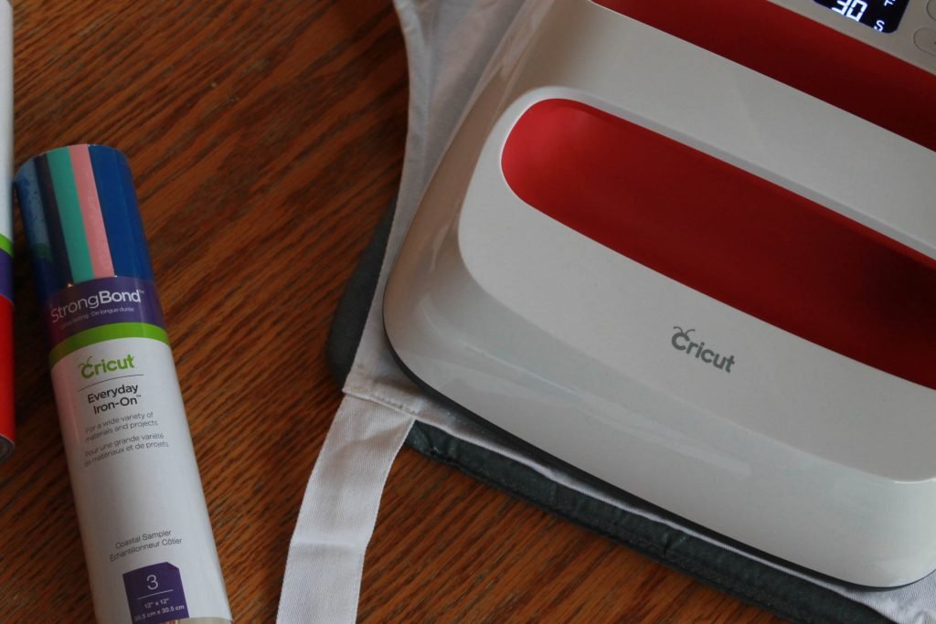 Cricut EasyPress Flatlay with assorted Everyday Iron-On Vinyl package