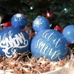 Two Frozen Ornaments Set In Bowl
