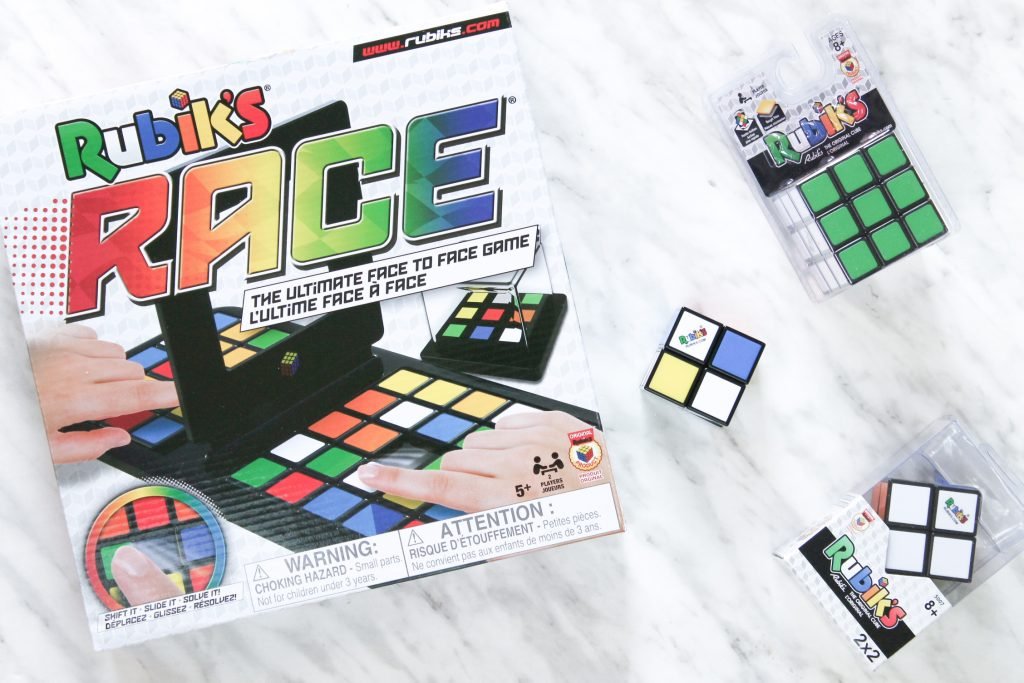 Flatlay of Rubik's Cubes & Rubik's Race Board Game