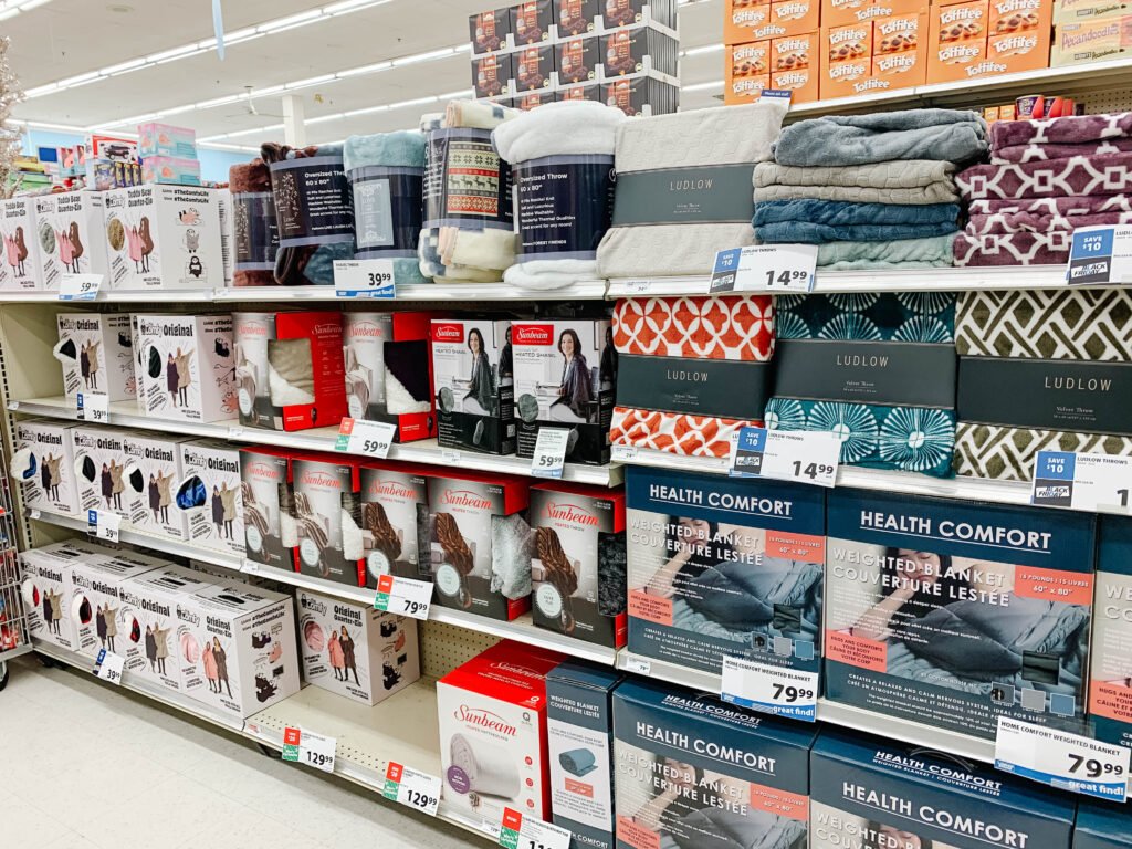 Display of various types of throws and heated blankets inside London Drugs