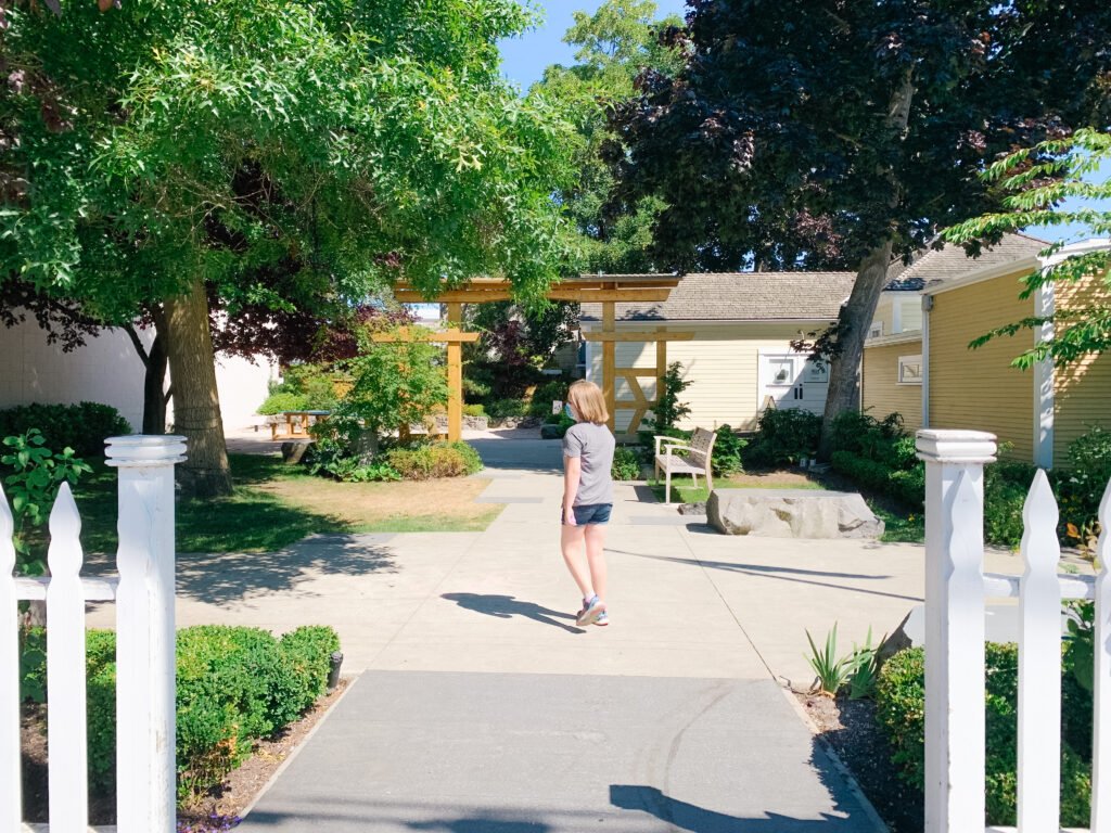 Girl standing in Steveston Museum Courtyard