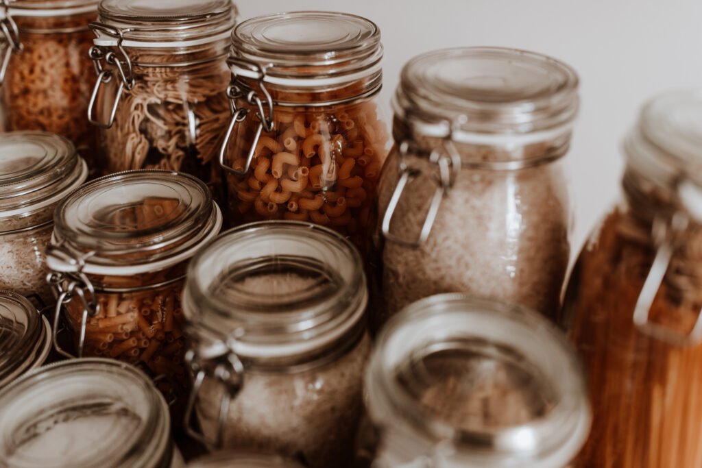 Photo of glass jars with pantry items inside to feature the rising costs of living