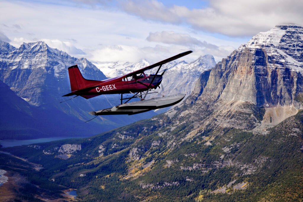 Plane flying over Canadian Rockies to shoot for Windborne Call of the Rockies