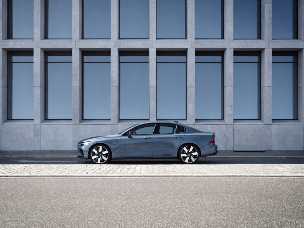 Volvo S60 Recharge T8, Thunder Grey  parked outside of a building